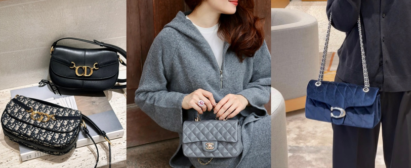 Woman styling a designer handbag with gold fashion jewelry