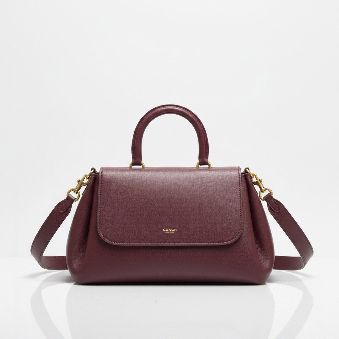 Burgundy slouchy leather bag with top handle and detachable shoulder strap
