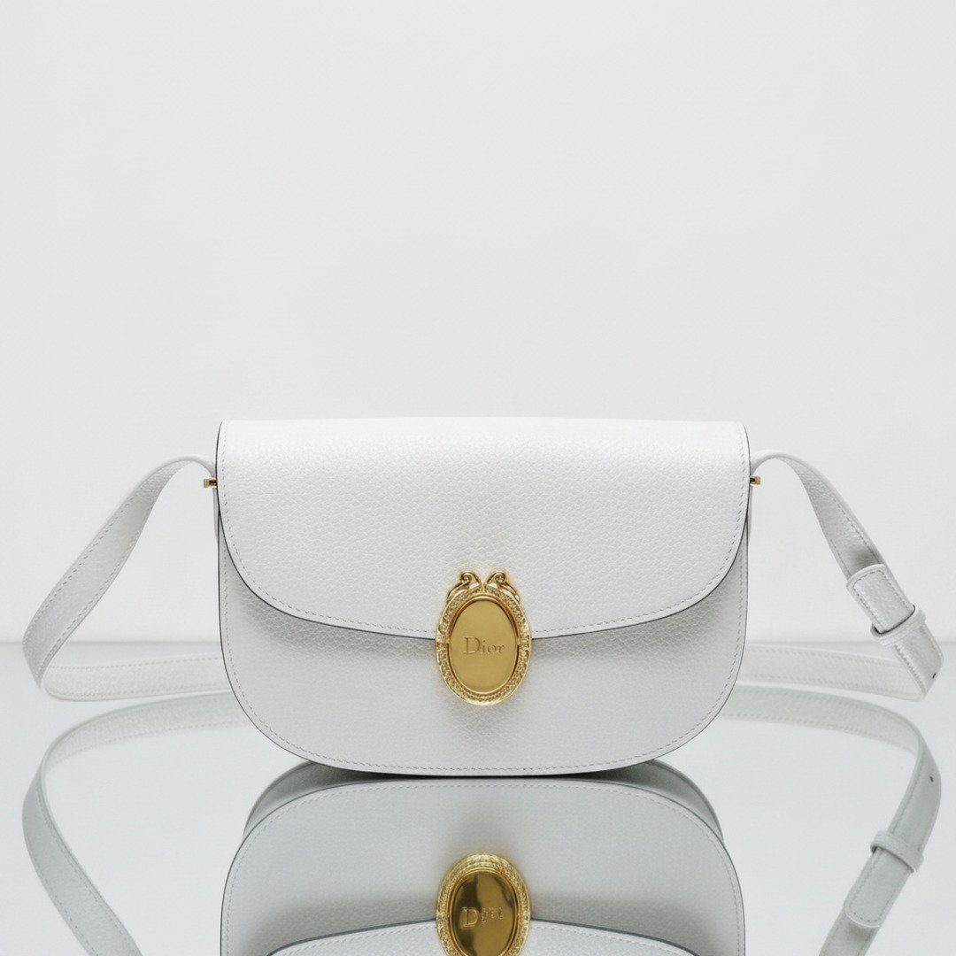 White grained calfskin medallion crossbody bag with oval gold-tone clasp